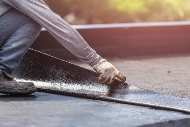Professional Basement Waterproofing technician working in De Mossville, KY